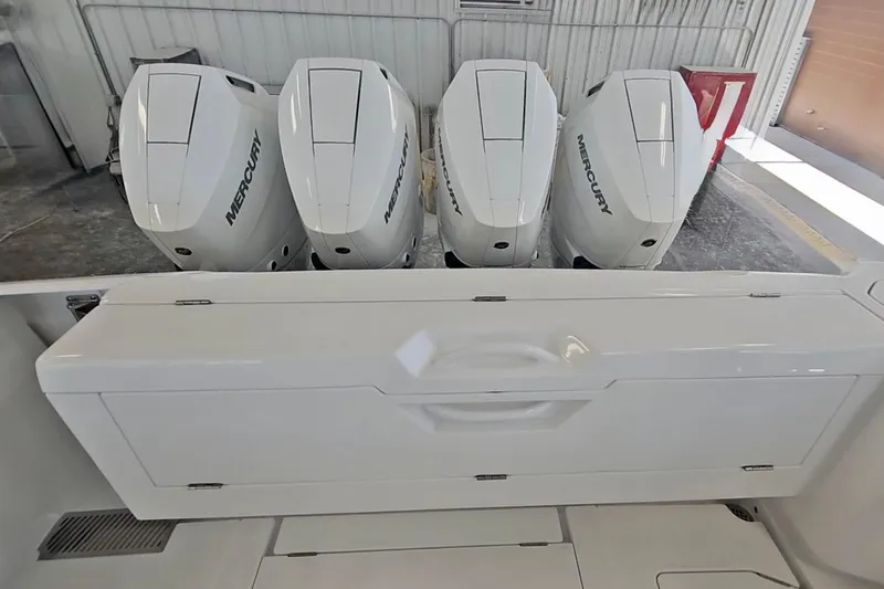 Yacht Photos Pics 2025 Intrepid 43 Nomad SE with four Mercury outboard engines in a garage setting.