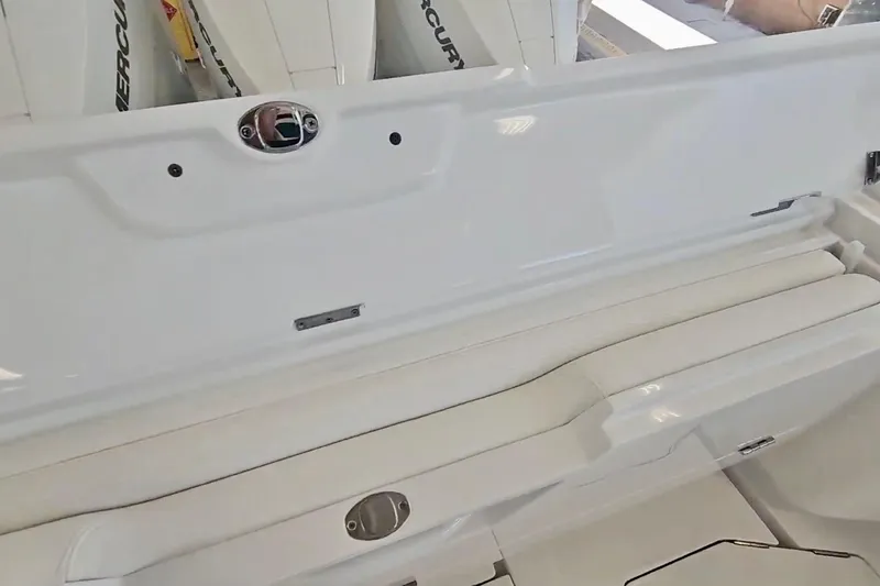  Yacht Photos Pics 2025 Intrepid 43 Nomad SE boat interior with white seating and Mercury engines.