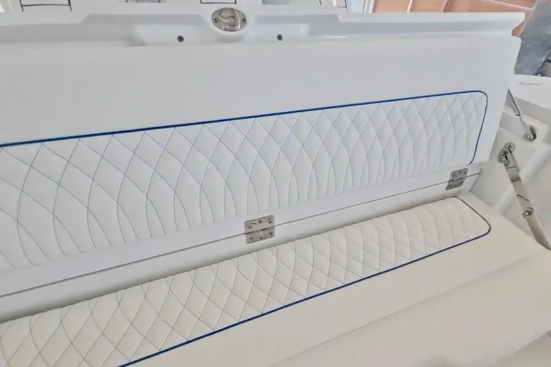  Yacht Photos Pics 2025 Intrepid 43 Nomad SE boat interior with quilted white seating.