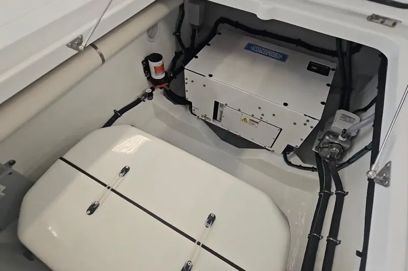  Yacht Photos Pics Engine compartment of 2025 Intrepid 43 Nomad SE boat, showcasing mechanical components.