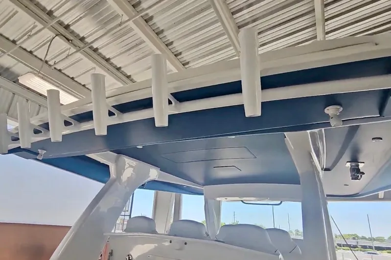  Yacht Photos Pics 2025 Intrepid 43 Nomad SE boat interior with rod holders and sleek design.