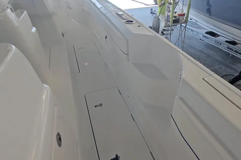  Yacht Photos Pics 2025 Intrepid 43 Nomad SE boat interior with storage compartments and sleek design.