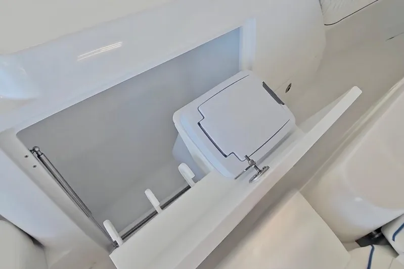 Yacht Photos Pics Intrepid 43 Nomad SE 2025 boat interior storage compartment with sleek design.