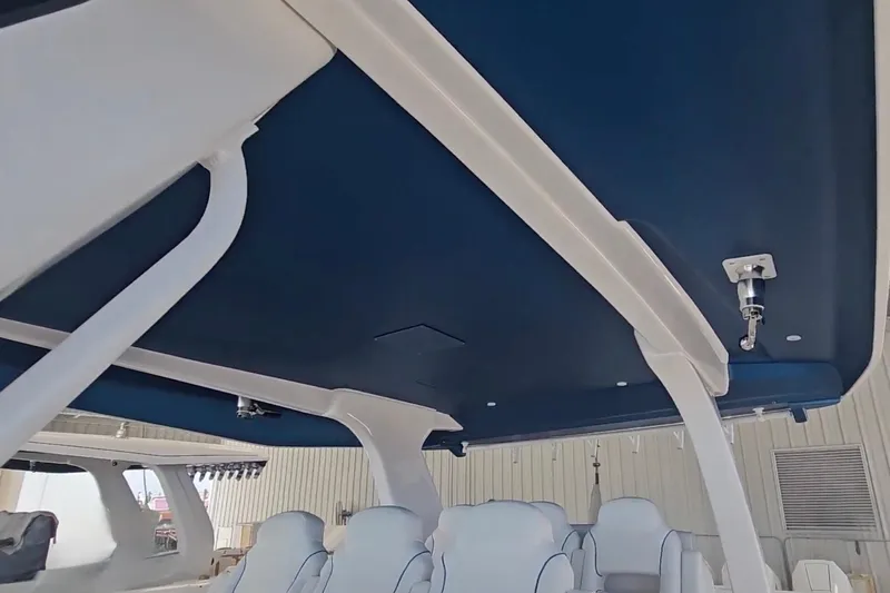  Yacht Photos Pics 2025 Intrepid 43 Nomad SE boat interior with sleek seating and modern design.