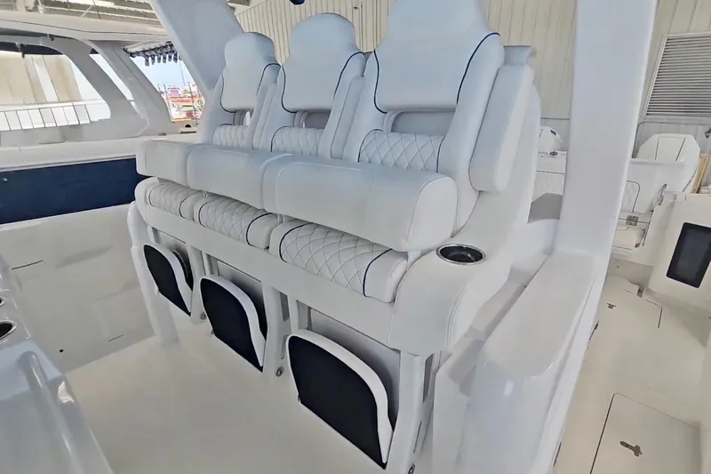  Yacht Photos Pics Luxurious seating on 2025 Intrepid 43 Nomad SE boat, featuring white leather upholstery.