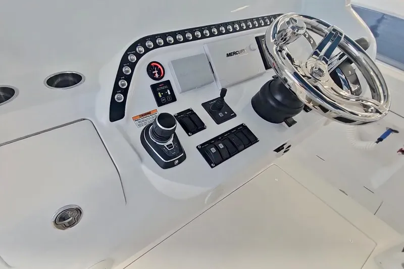  Yacht Photos Pics 2025 Intrepid 43 Nomad SE helm with modern controls and sleek steering wheel.
