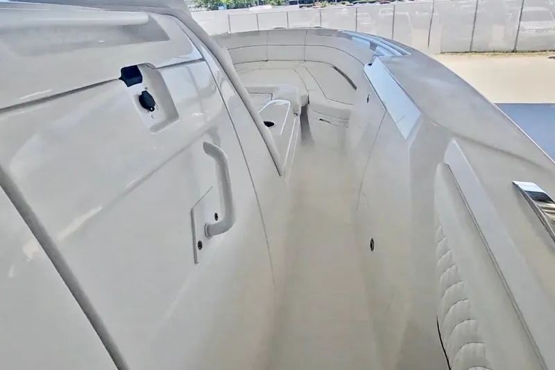  Yacht Photos Pics 2025 Intrepid 43 Nomad SE boat interior, showcasing sleek design and spacious seating.