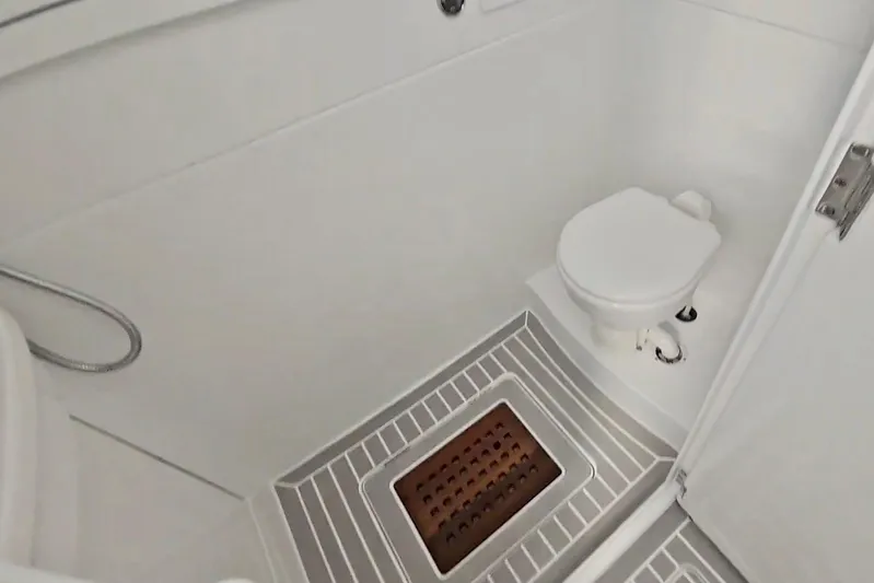  Yacht Photos Pics 2025 Intrepid 43 Nomad SE boat bathroom with toilet and shower area.