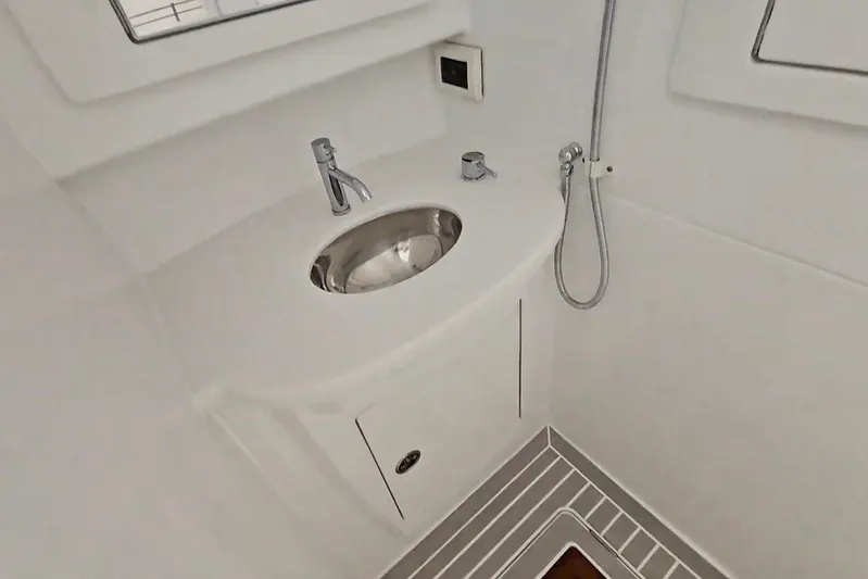  Yacht Photos Pics 2025 Intrepid 43 Nomad SE bathroom with modern sink and shower.