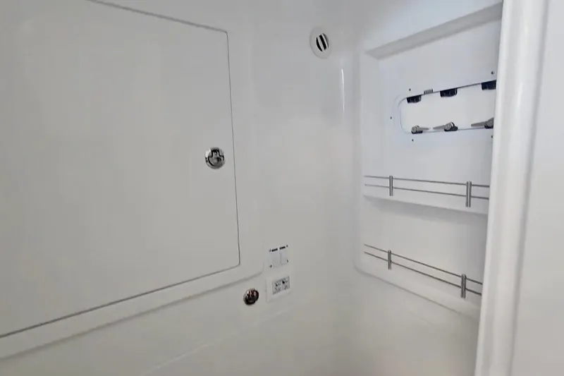  Yacht Photos Pics Interior of 2025 Intrepid 43 Nomad SE boat, featuring storage compartments and sleek design.