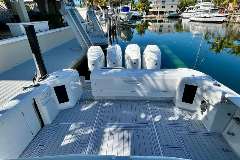 La Tuya Yacht Photos Pics 2025 Intrepid 43 Nomad SE boat with four outboard engines docked in a marina.