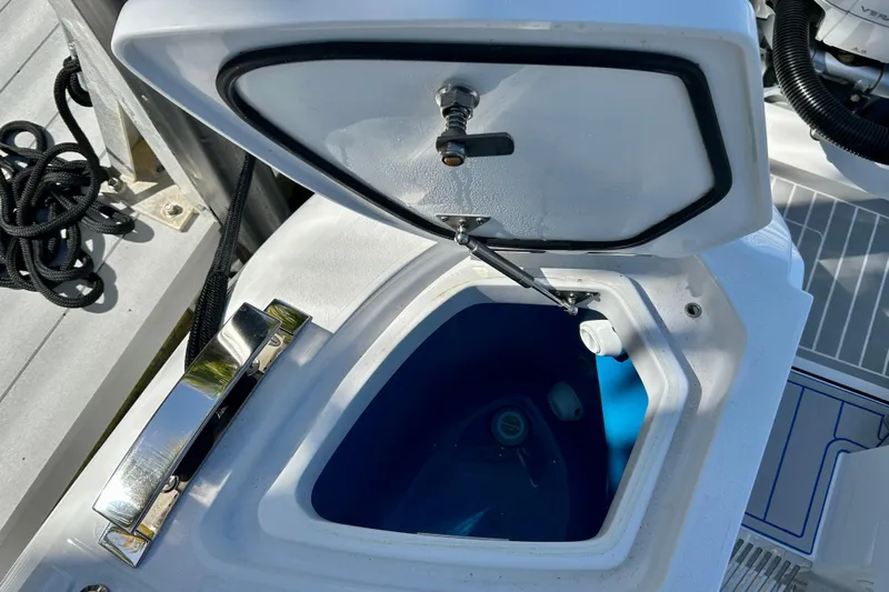 La Tuya Yacht Photos Pics Open storage compartment on 2025 Intrepid 43 Nomad SE boat deck.