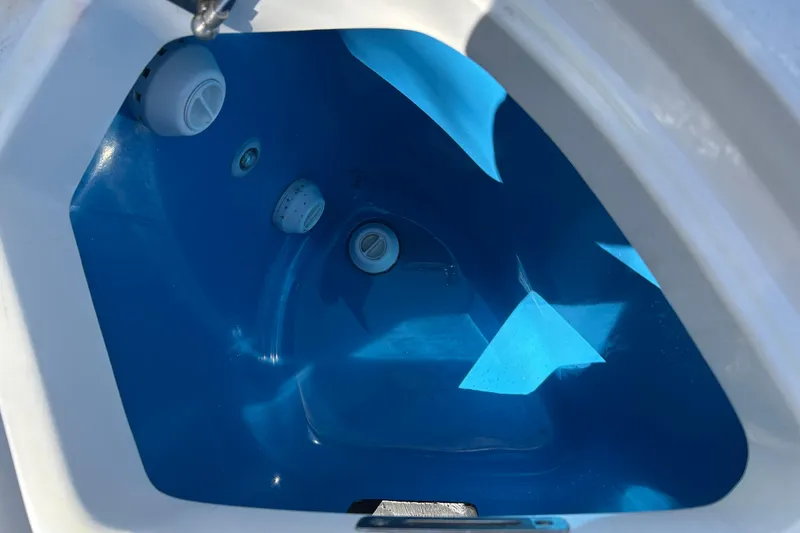 La Tuya Yacht Photos Pics Livewell interior of 2025 Intrepid 43 Nomad SE boat, featuring blue finish and fittings.