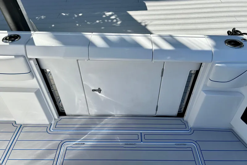 La Tuya Yacht Photos Pics 2025 Intrepid 43 Nomad SE boat deck with storage compartment and sleek design.