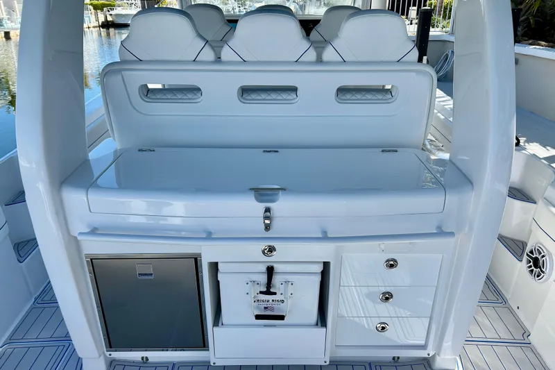 La Tuya Yacht Photos Pics 2025 Intrepid 43 Nomad SE boat interior with seating and storage compartments.