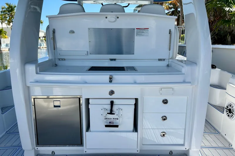 La Tuya Yacht Photos Pics 2025 Intrepid 43 Nomad SE boat interior with storage and seating.