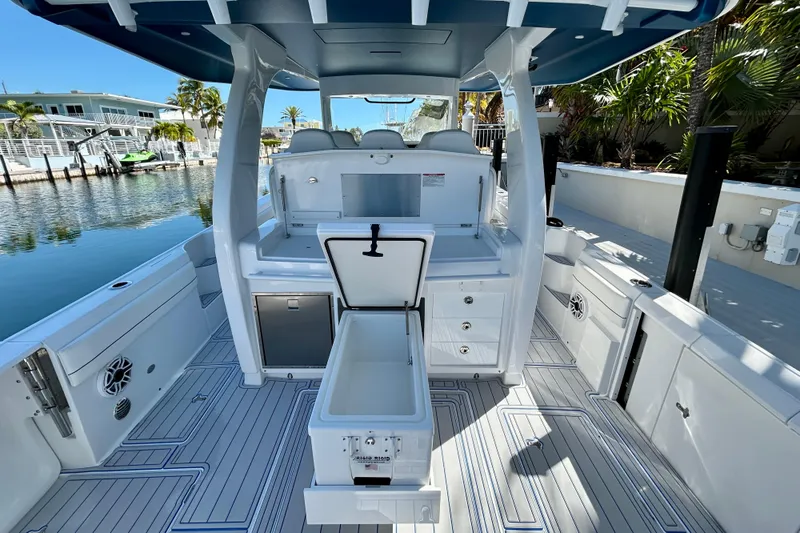 La Tuya Yacht Photos Pics 2025 Intrepid 43 Nomad SE boat interior with open storage, sleek design, and waterfront view.