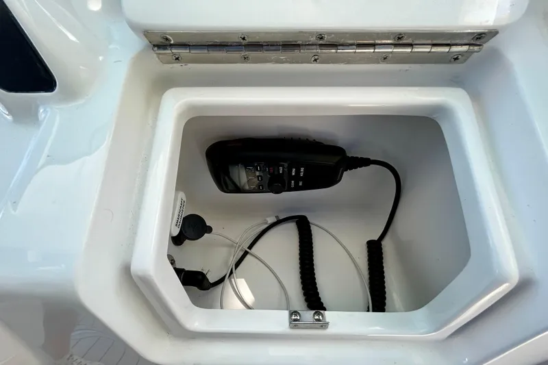 La Tuya Yacht Photos Pics Storage compartment on 2025 Intrepid 43 Nomad SE boat with communication device.