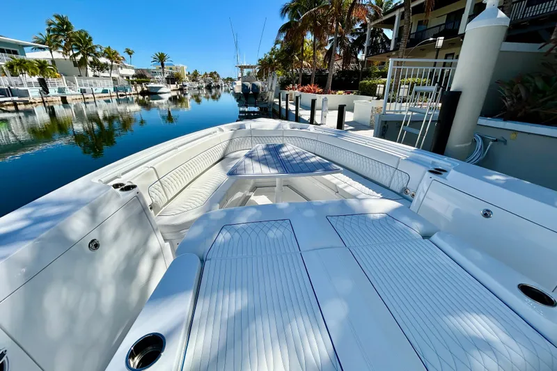 La Tuya Yacht Photos Pics 2025 Intrepid 43 Nomad SE luxury boat docked in a scenic canal setting.