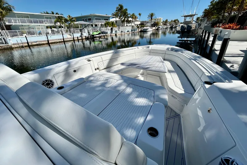 La Tuya Yacht Photos Pics Luxurious 2025 Intrepid 43 Nomad SE yacht docked in a serene waterfront setting.