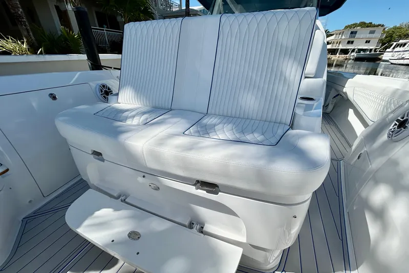 La Tuya Yacht Photos Pics Luxury seating on 2025 Intrepid 43 Nomad SE boat, featuring sleek white upholstery.