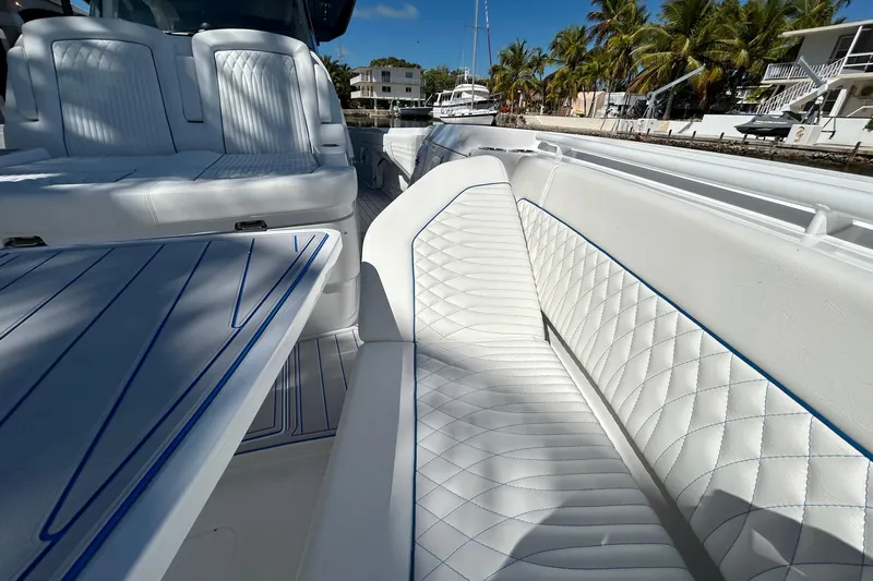 La Tuya Yacht Photos Pics 2025 Intrepid 43 Nomad SE boat with luxurious white seating and sleek design.