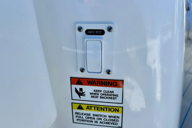 La Tuya Yacht Photos Pics Backrest control panel with warning labels on 2025 Intrepid 43 Nomad SE boat.