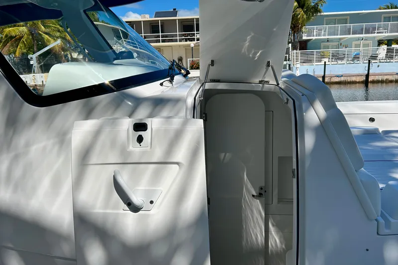 La Tuya Yacht Photos Pics 2025 Intrepid 43 Nomad SE boat cabin entrance with open door, dockside view.