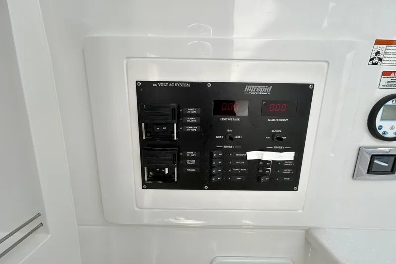 La Tuya Yacht Photos Pics 2025 Intrepid 43 Nomad SE electrical panel with 120V AC system controls.
