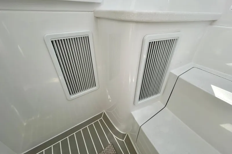 La Tuya Yacht Photos Pics Interior view of 2025 Intrepid 43 Nomad SE boat with vented panels and steps.