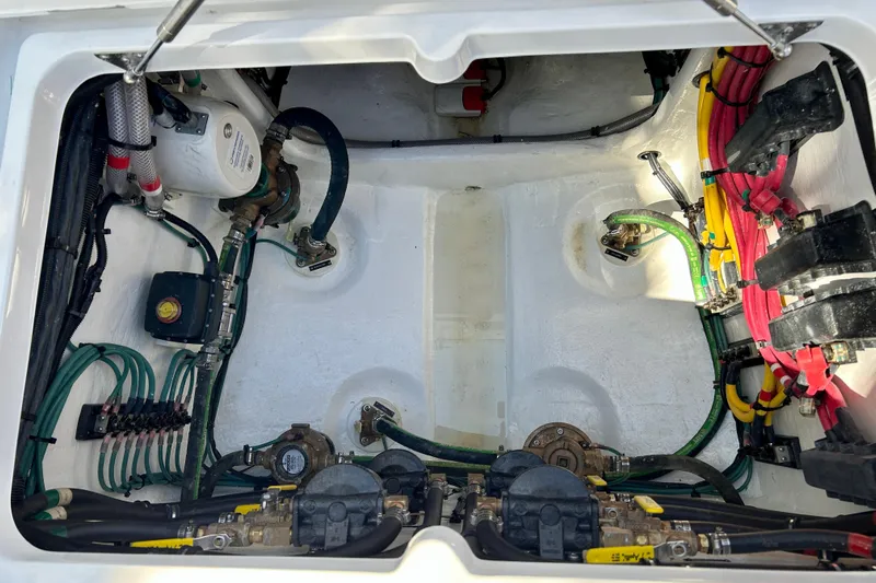 La Tuya Yacht Photos Pics Engine compartment of 2025 Intrepid 43 Nomad SE, showcasing wiring and mechanical components.