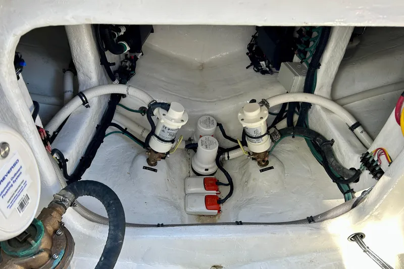 La Tuya Yacht Photos Pics Engine compartment of 2025 Intrepid 43 Nomad SE with visible hoses and filters.
