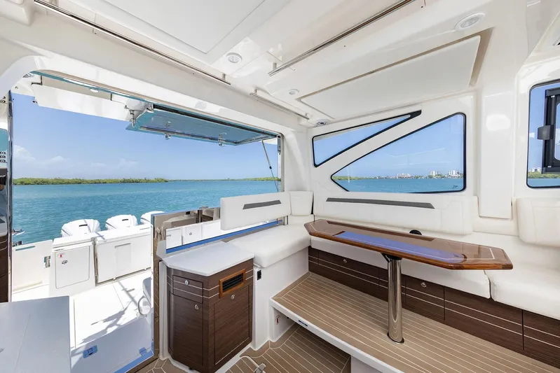  Yacht Photos Pics Manufacturer Provided Image: 2025 Pursuit OS 445 Offshore yacht interior with elegant seating and ocean view.