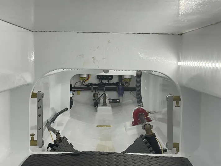  Yacht Photos Pics 2023 Custom Carolina Irving Forbes boat interior, showing clean, white engine compartment.