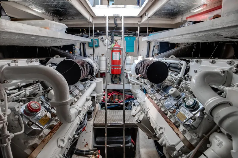 Double H Yacht Photos Pics Engine room of 2008 Sea Ray 60 Sundancer yacht, featuring dual engines and safety equipment.