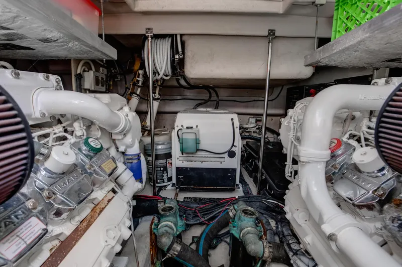 Double H Yacht Photos Pics Engine room of a 2008 Sea Ray 60 Sundancer yacht, showcasing mechanical components.