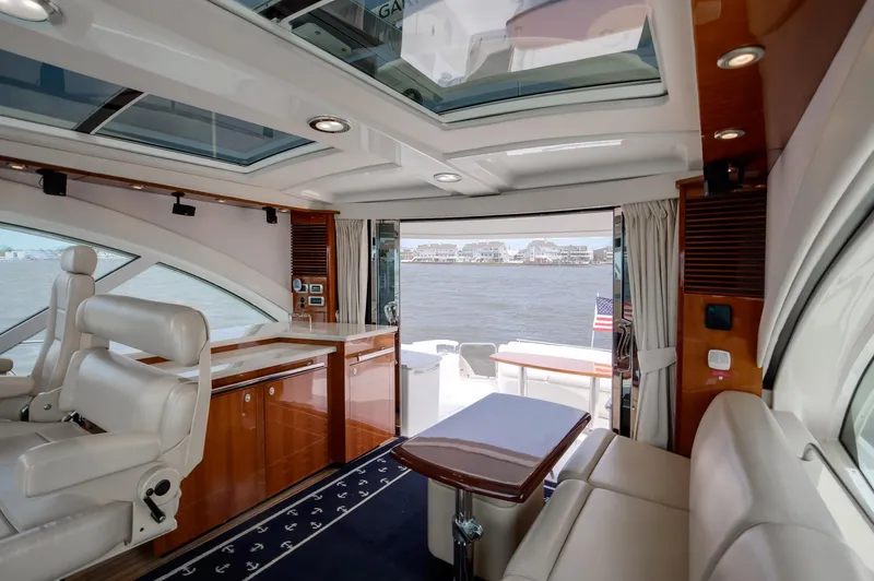 Double H Yacht Photos Pics Luxurious interior of a 2008 Sea Ray 60 Sundancer yacht with waterfront view.