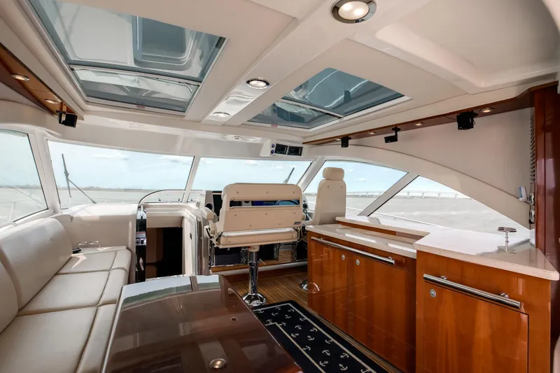 Double H Yacht Photos Pics Luxurious interior of 2008 Sea Ray 60 Sundancer yacht with panoramic windows and elegant seating.