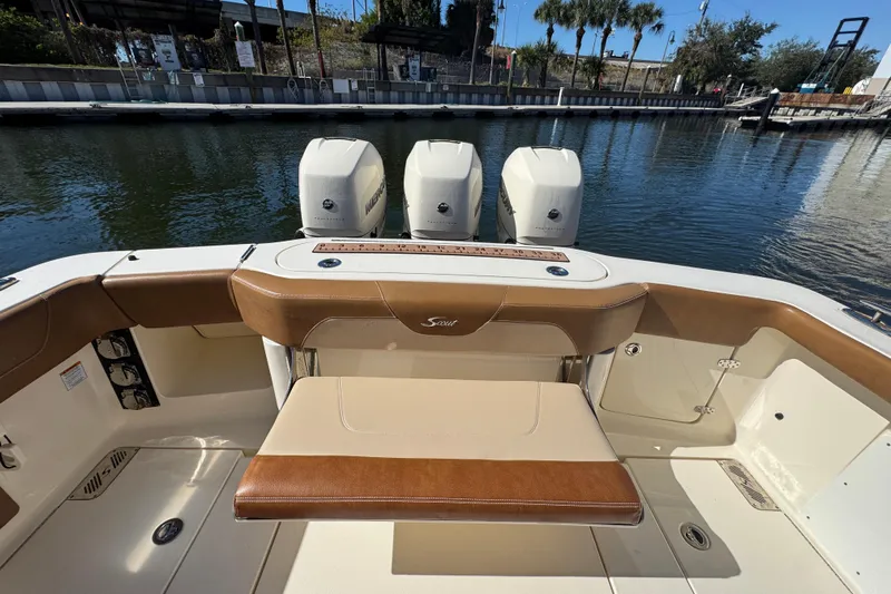  Yacht Photos Pics 2019 Scout 355 LXF boat interior with triple outboard engines at dock.