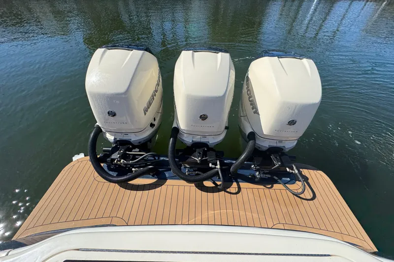  Yacht Photos Pics 2019 Scout 355 LXF boat with triple Mercury outboard engines on water.