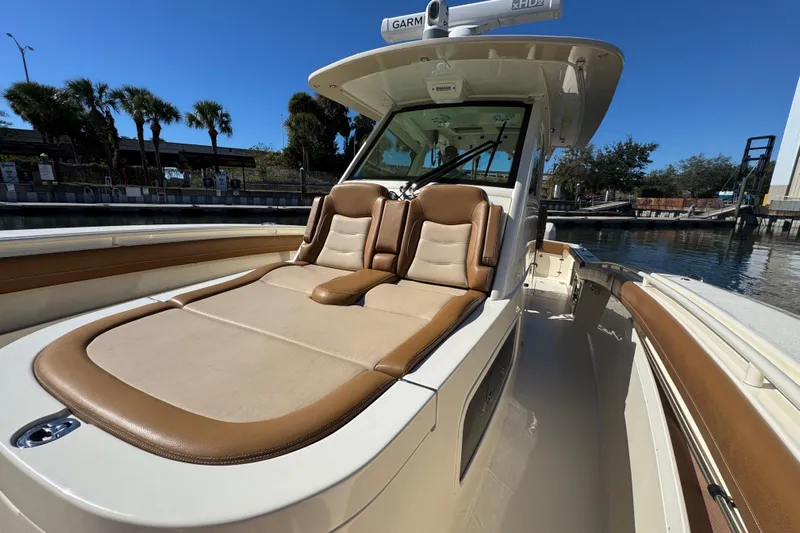  Yacht Photos Pics 2019 Scout 355 LXF boat with luxurious tan seating and sleek design.