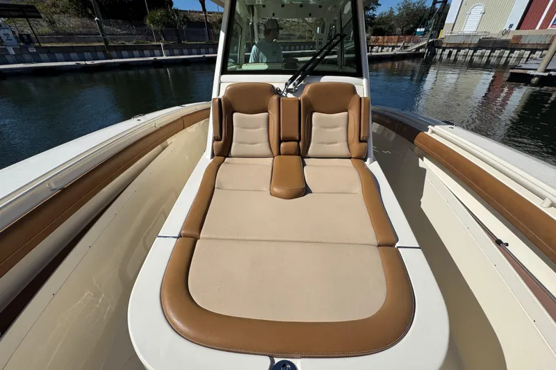  Yacht Photos Pics 2019 Scout 355 LXF boat interior with tan and brown seating.