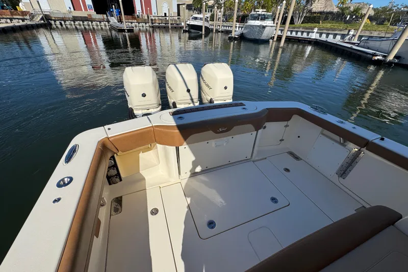  Yacht Photos Pics 2019 Scout 355 LXF boat with triple engines docked at marina.