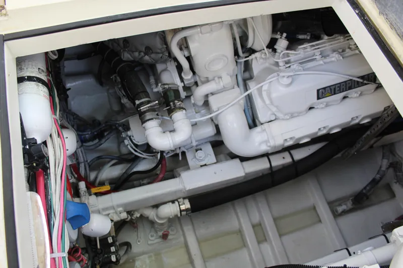 Carolina Girl Yacht Photos Pics Engine compartment of 1985 Viking Express boat, featuring Caterpillar engine components.