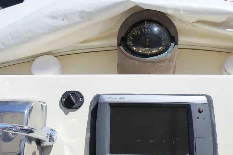 Carolina Girl Yacht Photos Pics 1985 Viking Express boat dashboard with compass and navigation display.