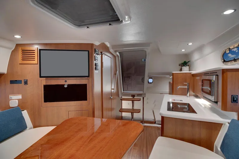  Yacht Photos Pics Manufacturer Provided Image: Luxurious interior of 2025 Pursuit OS 355 Offshore boat with modern amenities and elegant design.