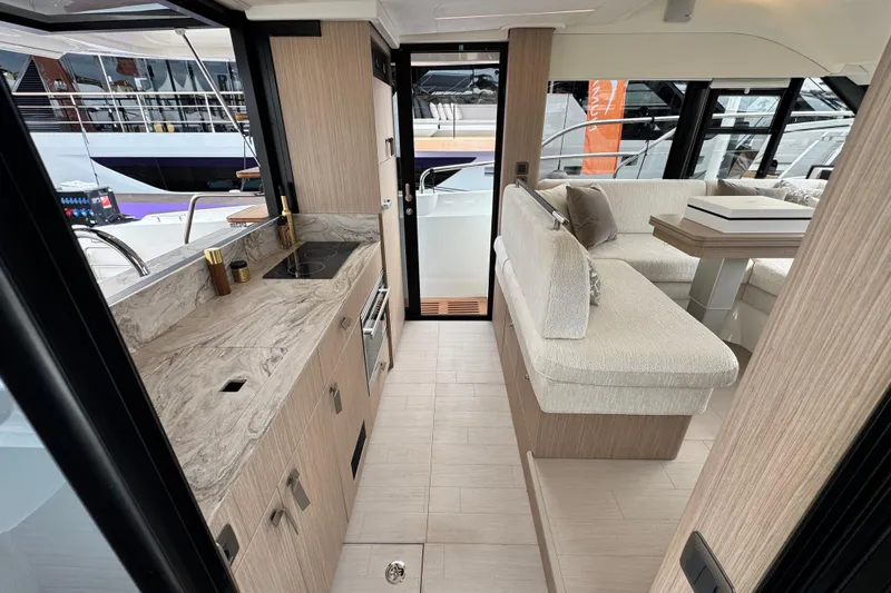  Yacht Photos Pics Luxurious interior of 2026 Prestige Yachts F4.3, featuring modern kitchen and seating area.