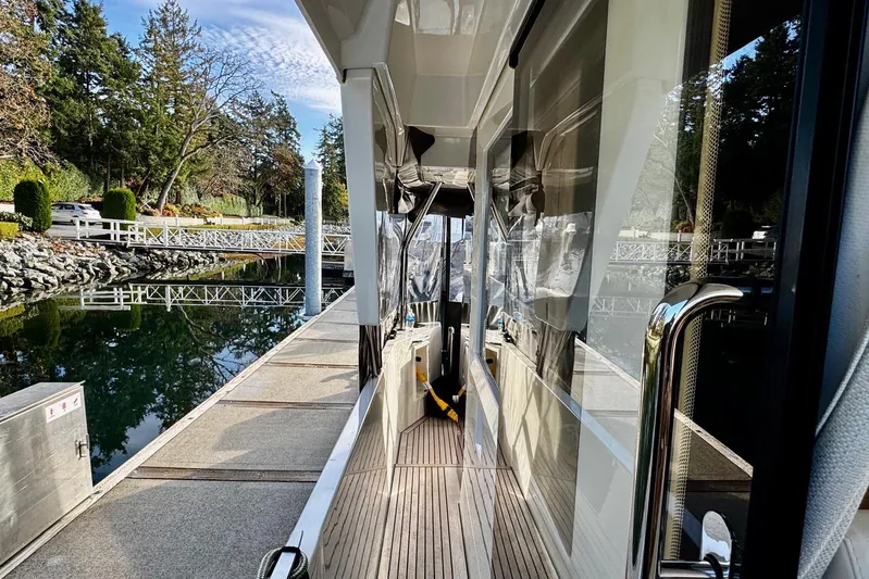 Changes In Latitude Yacht Photos Pics 2022 Beneteau Swift Trawler 41 Fly docked, showcasing sleek design and modern features.