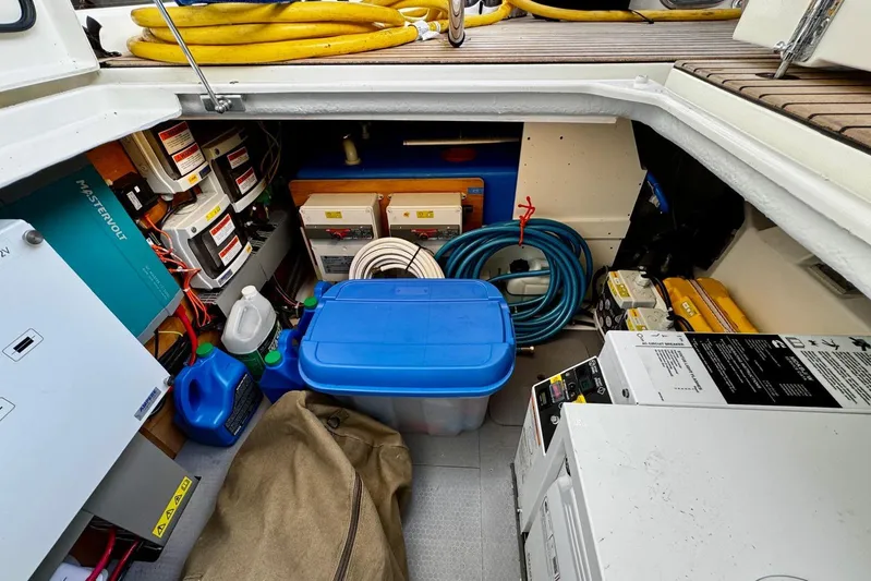 Changes In Latitude Yacht Photos Pics Storage compartment of 2022 Beneteau Swift Trawler 41 Fly with equipment and supplies.