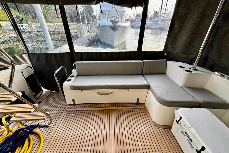 Changes In Latitude Yacht Photos Pics Interior of 2022 Beneteau Swift Trawler 41 Fly with seating and wooden flooring.